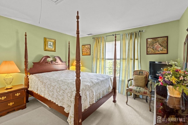 bedroom featuring carpet flooring and visible vents