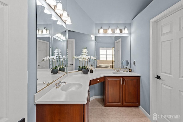 bathroom with a sink, double vanity, and tile patterned flooring