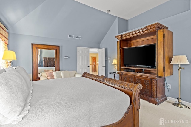 carpeted bedroom with visible vents, lofted ceiling, and baseboards