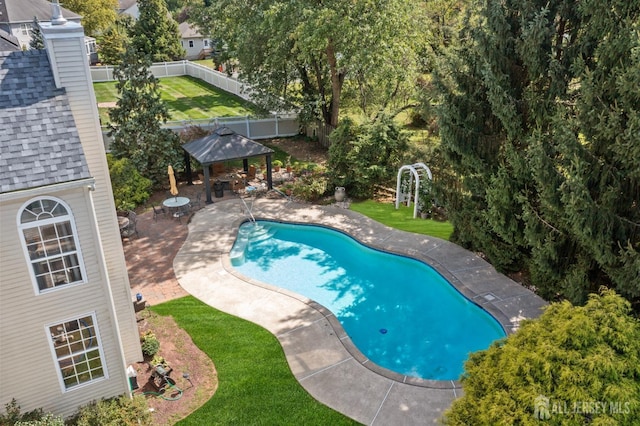 view of swimming pool with a gazebo, a patio area, a yard, and fence