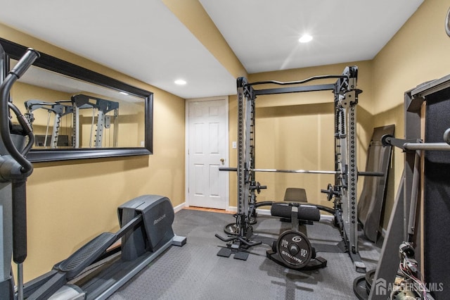 exercise room featuring recessed lighting and baseboards