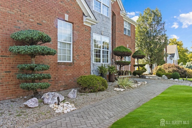 view of home's exterior with brick siding