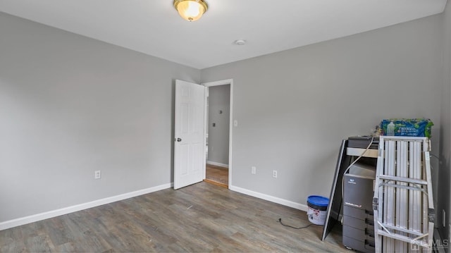 unfurnished bedroom with wood-type flooring