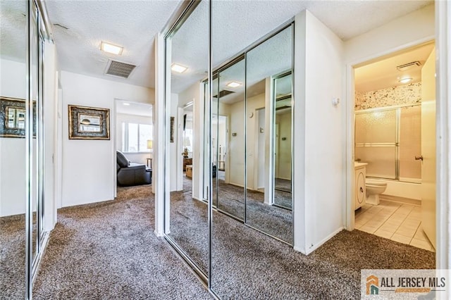 159 Pitman Rd Unit C, Monroe, NJ 08831 - interior space with carpet flooring, a textured ceiling, and tile patterned floors