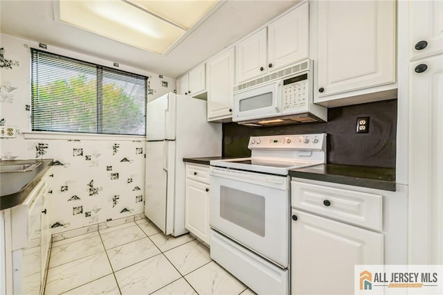 159 Pitman Rd Unit C, Monroe, NJ 08831 - kitchen with dark countertops, white appliances, marble finish floor, and white cabinetry