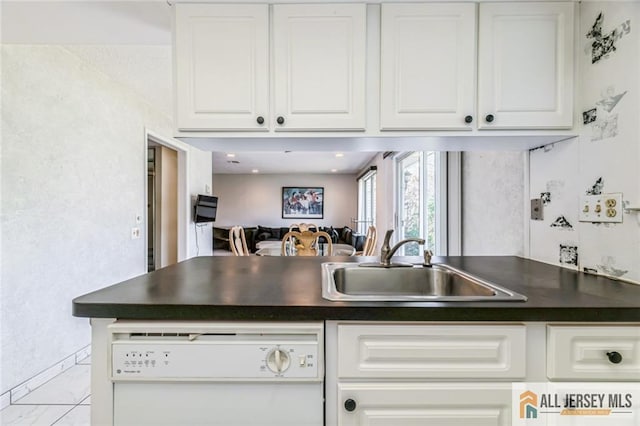 159 Pitman Rd Unit C, Monroe, NJ 08831 - kitchen featuring white cabinetry, dark countertops, white dishwasher, and a sink