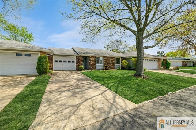 159 Pitman Rd Unit C, Monroe, NJ 08831 - ranch-style home featuring concrete driveway, brick siding, a front lawn, and a garage