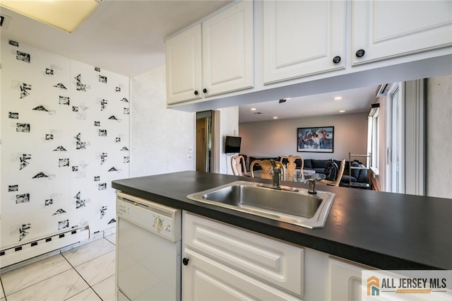 159 Pitman Rd Unit C, Monroe, NJ 08831 - kitchen with a baseboard heating unit, a sink, white dishwasher, white cabinetry, and dark countertops