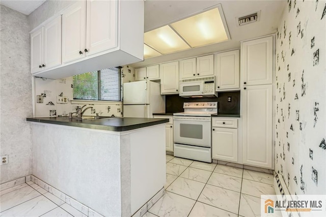 159 Pitman Rd Unit C, Monroe, NJ 08831 - kitchen with dark countertops, marble finish floor, wallpapered walls, and white appliances