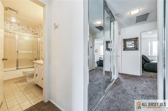 159 Pitman Rd Unit C, Monroe, NJ 08831 - full bath featuring tile patterned floors, visible vents, bath / shower combo with glass door, and vanity