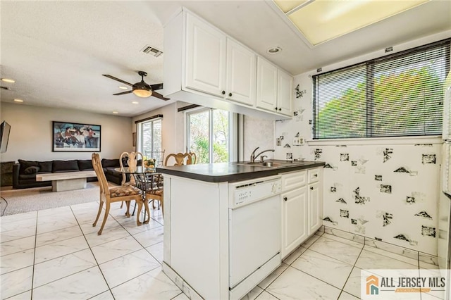 159 Pitman Rd Unit C, Monroe, NJ 08831 - kitchen featuring a sink, white dishwasher, marble finish floor, visible vents, and dark countertops
