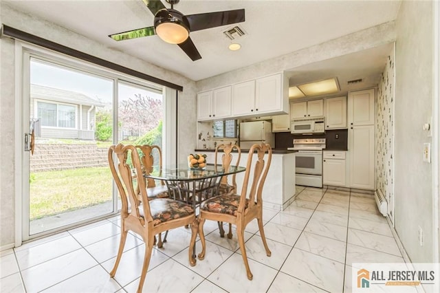 159 Pitman Rd Unit C, Monroe, NJ 08831 - dining room with visible vents, a ceiling fan, marble finish floor, and baseboards