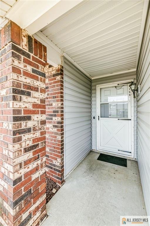159 Pitman Rd Unit C, Monroe, NJ 08831 - property entrance featuring brick siding and a porch