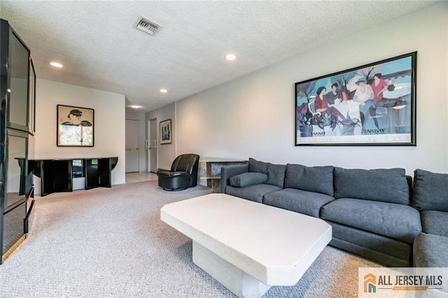 159 Pitman Rd Unit C, Monroe, NJ 08831 - carpeted living room with a textured ceiling, visible vents, and recessed lighting