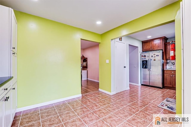 907 Maple Hill Dr Unit 907, Woodbridge Proper, NJ 07095 - kitchen featuring stainless steel refrigerator with ice dispenser, recessed lighting, light tile patterned floors, and light countertops