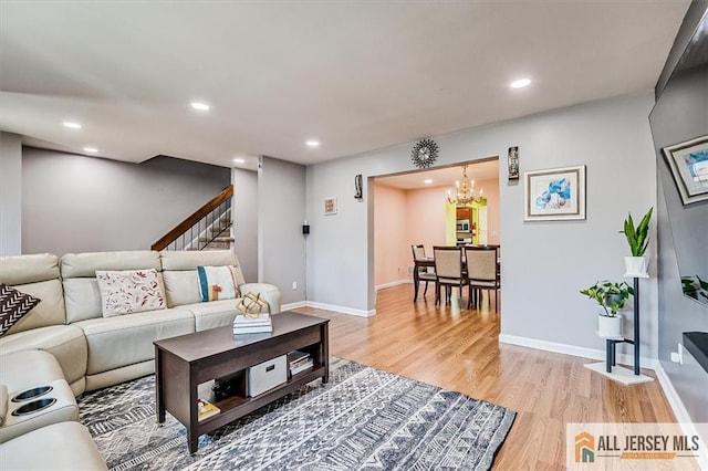 907 Maple Hill Dr Unit 907, Woodbridge Proper, NJ 07095 - living room featuring light wood-type flooring, stairway, recessed lighting, and a chandelier