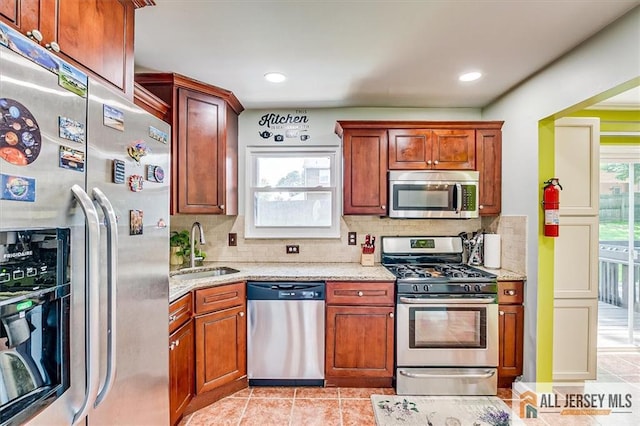 907 Maple Hill Dr Unit 907, Woodbridge Proper, NJ 07095 - kitchen featuring stainless steel appliances, decorative backsplash, light stone counters, light tile patterned flooring, and recessed lighting