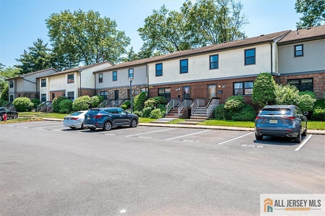907 Maple Hill Dr Unit 907, Woodbridge Proper, NJ 07095 - view of building exterior featuring uncovered parking