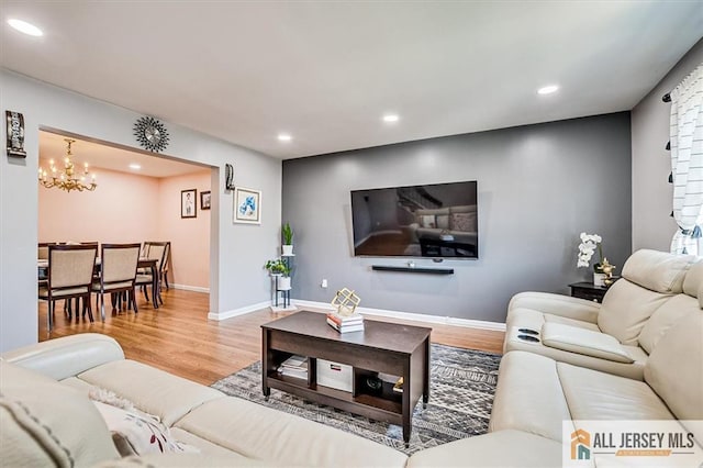 907 Maple Hill Dr Unit 907, Woodbridge Proper, NJ 07095 - living room with wood finished floors, a chandelier, and recessed lighting