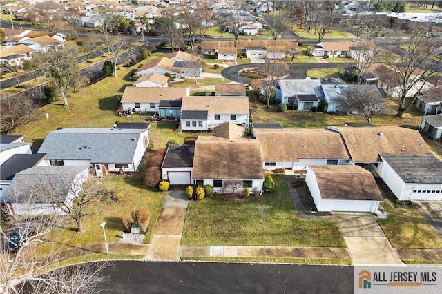 birds eye view of property with a residential view