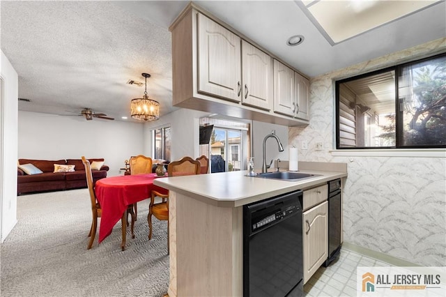 kitchen with visible vents, dishwasher, open floor plan, light countertops, and a textured ceiling