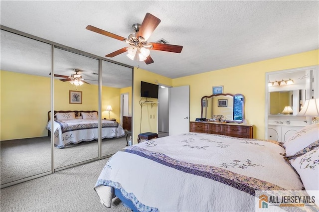 carpeted bedroom featuring a closet, ceiling fan, and a textured ceiling