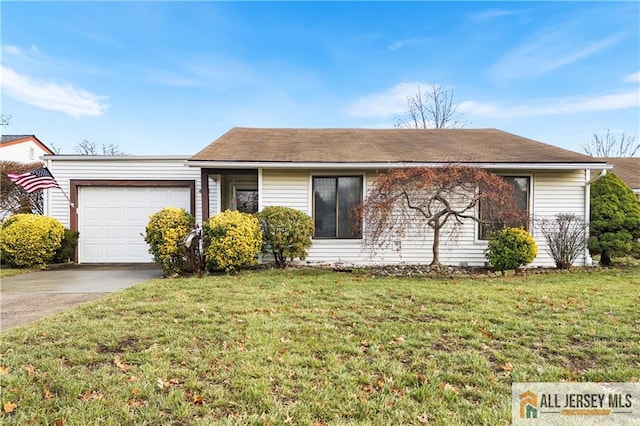 single story home featuring a front lawn, driveway, and an attached garage