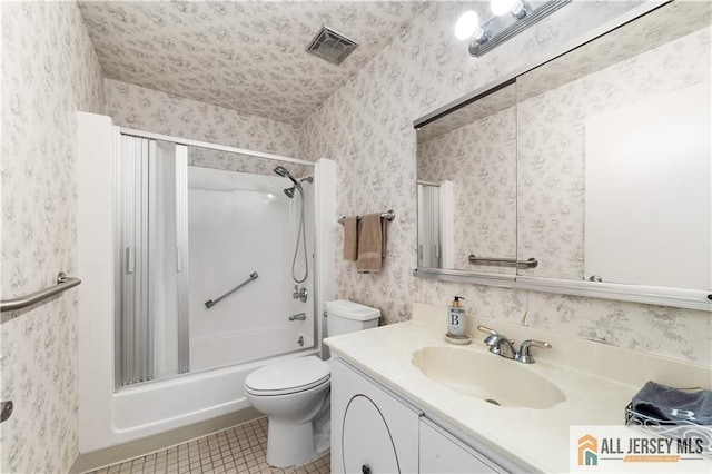 bathroom with wallpapered walls, visible vents, toilet, vanity, and shower / washtub combination