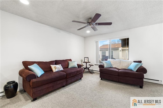 carpeted living room with a baseboard heating unit, recessed lighting, ceiling fan, and a textured ceiling