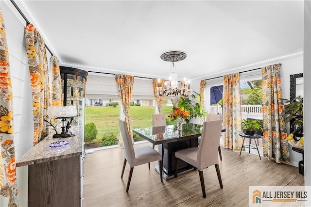 275 Convent Rd Unit 275A, Monroe, NJ 08831 - dining area featuring a chandelier, wood finished floors, and crown molding