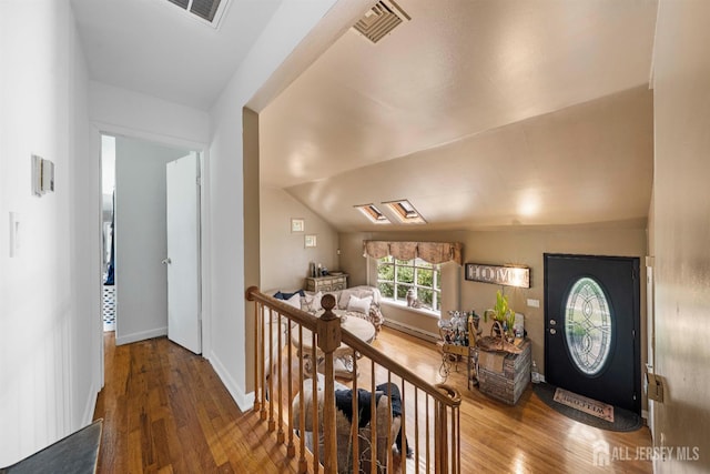 101 Weston Rd, Franklin, NJ 08873 - foyer entrance featuring wood finished floors, vaulted ceiling, and a baseboard radiator
