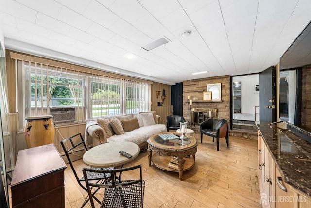 101 Weston Rd, Franklin, NJ 08873 - living room with wood walls, a baseboard heating unit, light wood-style floors, and a fireplace