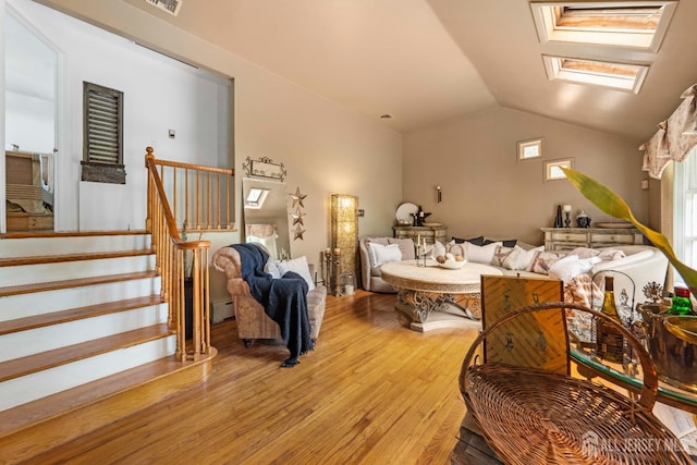 101 Weston Rd, Franklin, NJ 08873 - living room featuring light wood finished floors, a skylight, lofted ceiling, stairway, and baseboard heating
