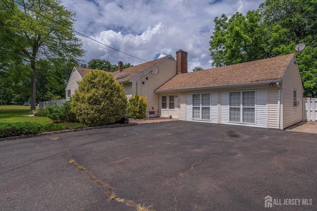 101 Weston Rd, Franklin, NJ 08873 - view of front of property with a chimney and driveway