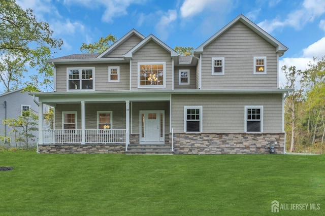 view of front facade with a front yard and a porch