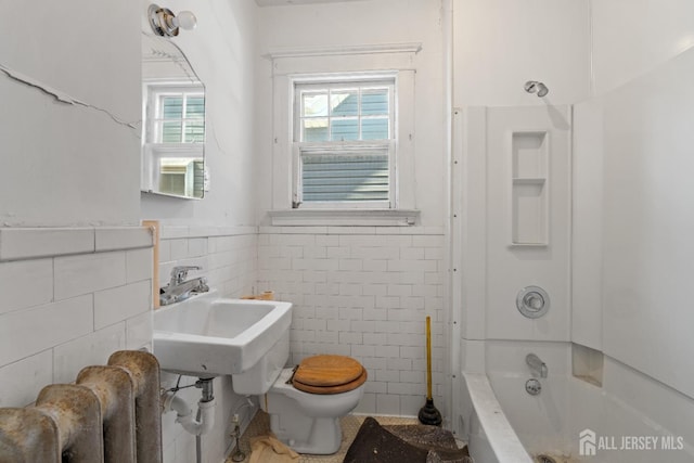 183 State St, Perth Amboy, NJ 08861 - full bathroom with tile walls, toilet, wainscoting, and shower / bath combination