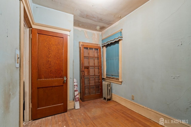 183 State St, Perth Amboy, NJ 08861 - entrance foyer with radiator heating unit and hardwood / wood-style floors