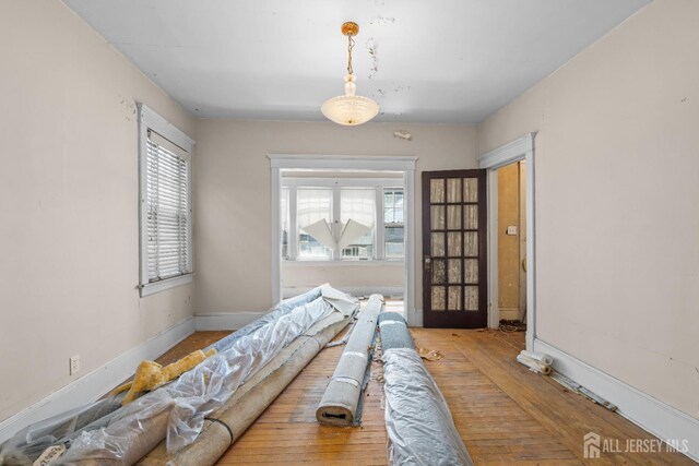 183 State St, Perth Amboy, NJ 08861 - living room featuring plenty of natural light, hardwood / wood-style floors, and baseboards