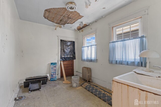 183 State St, Perth Amboy, NJ 08861 - spare room featuring radiator heating unit