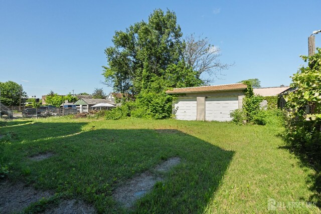 183 State St, Perth Amboy, NJ 08861 - view of yard with a garage