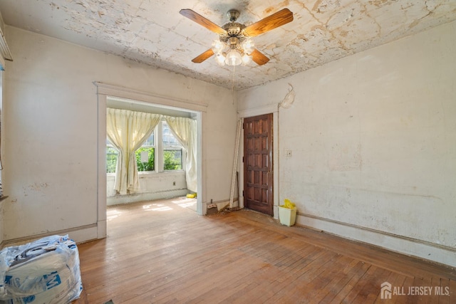 183 State St, Perth Amboy, NJ 08861 - spare room with light wood-type flooring and a ceiling fan