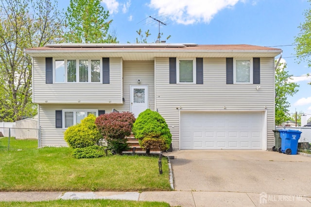 14 Bonnie Ln, Colonia, NJ 07067 - bi-level home with an attached garage, solar panels, and driveway