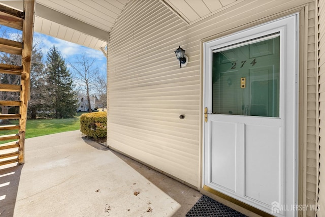 entrance to property with a patio area