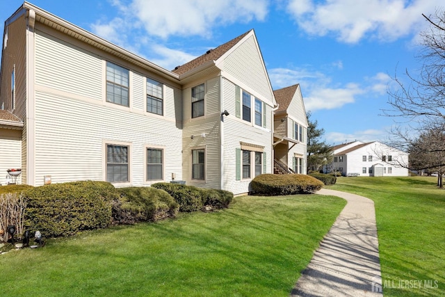 view of home's exterior featuring a lawn