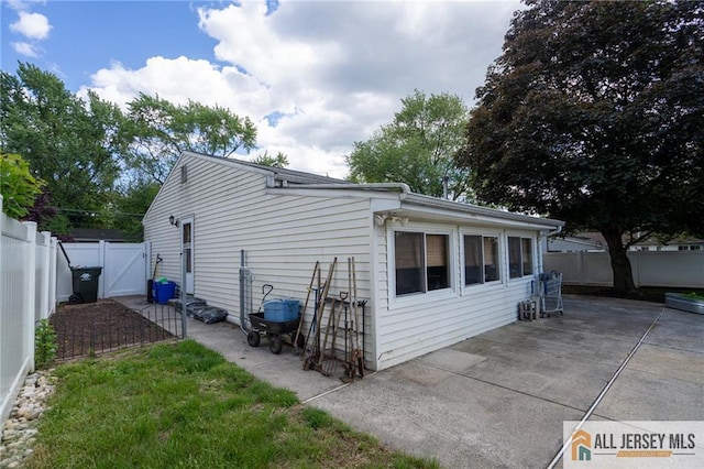 7 Cornell Rd, Old Bridge, NJ 08859 - view of side of home featuring a gate, a patio, and a fenced backyard
