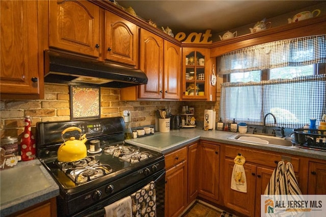 7 Cornell Rd, Old Bridge, NJ 08859 - kitchen with black gas range, a sink, under cabinet range hood, tasteful backsplash, and brown cabinets