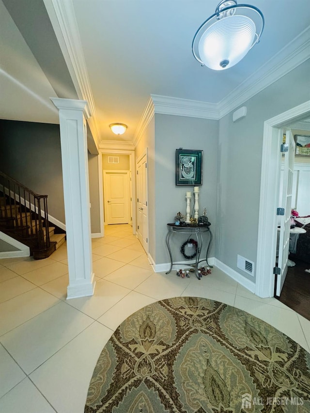 corridor featuring visible vents, ornamental molding, decorative columns, stairs, and light tile patterned floors