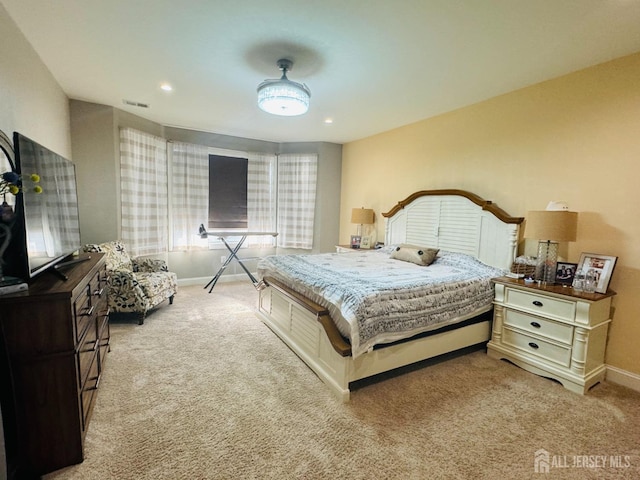 carpeted bedroom with baseboards, recessed lighting, and visible vents