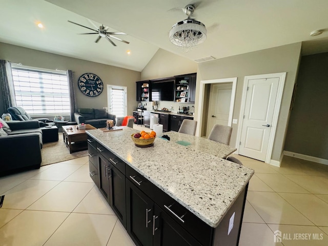 12 Gables Way, Monroe, NJ 08831 - kitchen with dark cabinets, light tile patterned floors, open floor plan, a ceiling fan, and a kitchen island