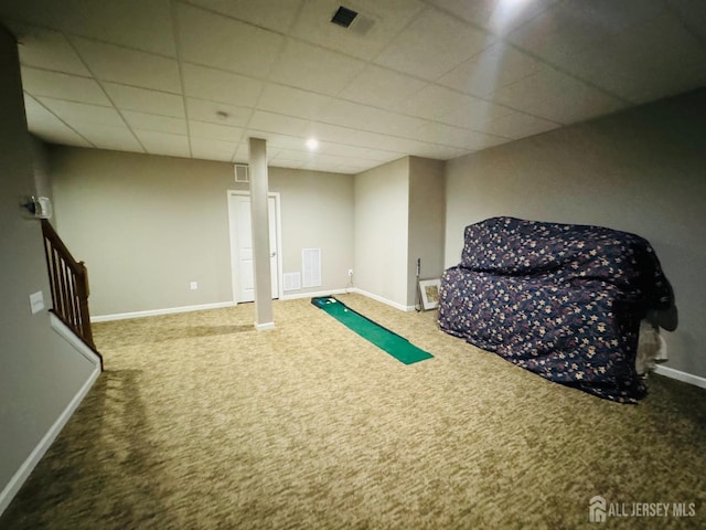 sitting room with carpet floors, baseboards, and a paneled ceiling